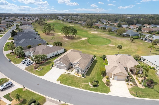 drone / aerial view featuring a residential view and golf course view