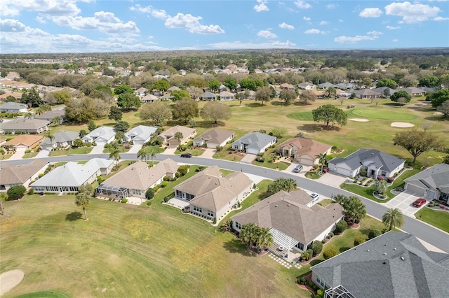 drone / aerial view with a residential view and golf course view