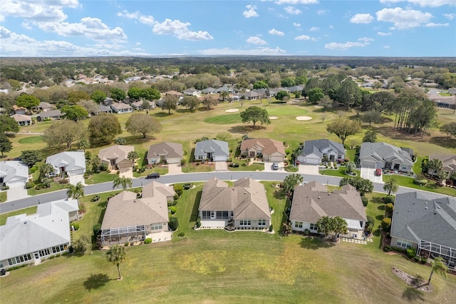 aerial view with a residential view and view of golf course