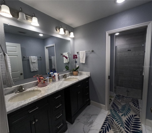 bathroom featuring vanity and a shower with shower door