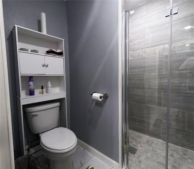 bathroom with toilet and walk in shower