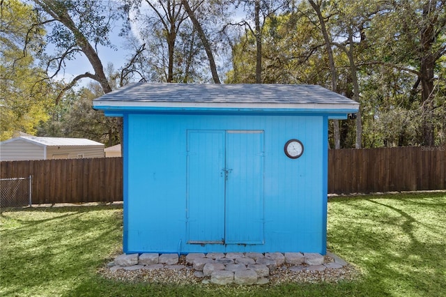 view of shed featuring a fenced backyard