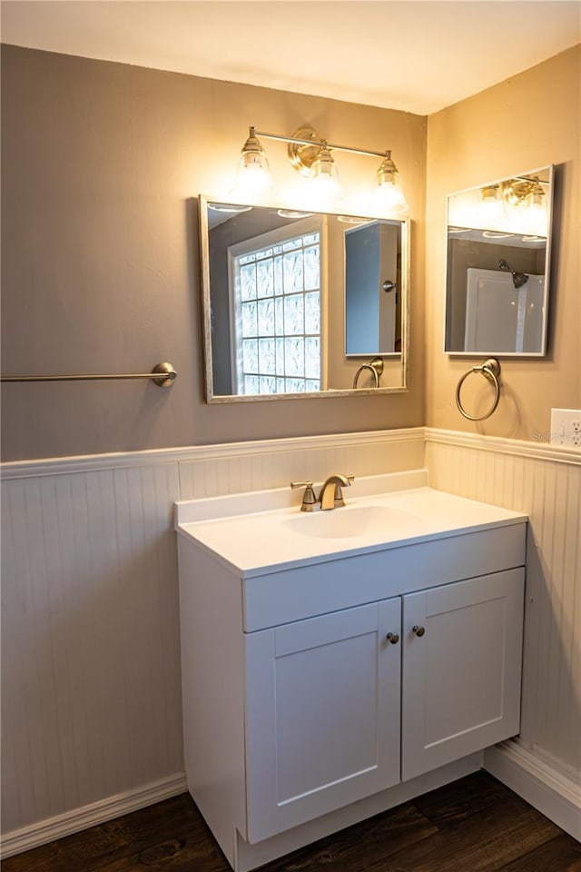 bathroom with vanity and hardwood / wood-style floors