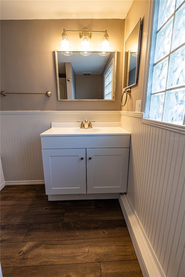 bathroom with vanity and hardwood / wood-style floors