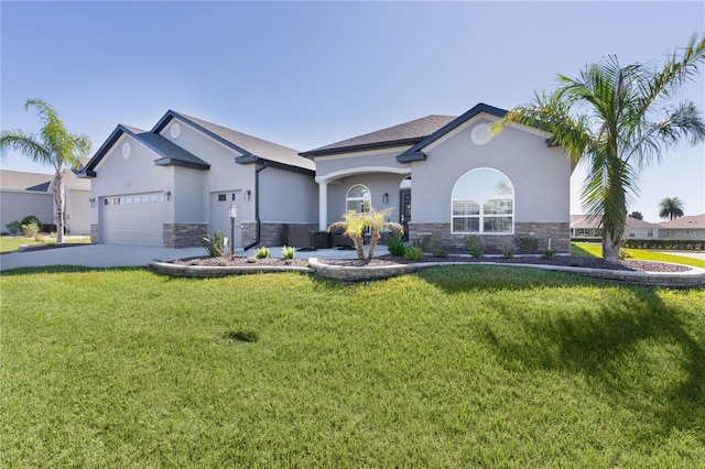 view of front of property featuring a front lawn and a garage