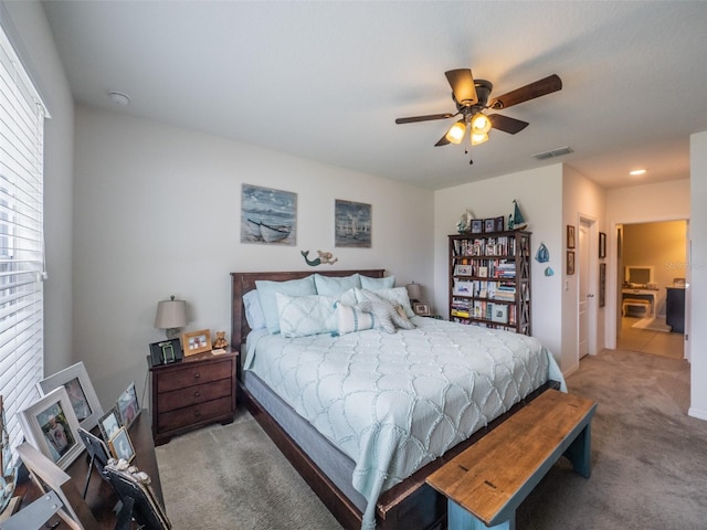 bedroom featuring carpet floors, ceiling fan, and visible vents