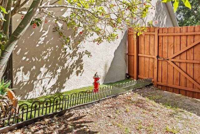 view of yard featuring a gate and fence