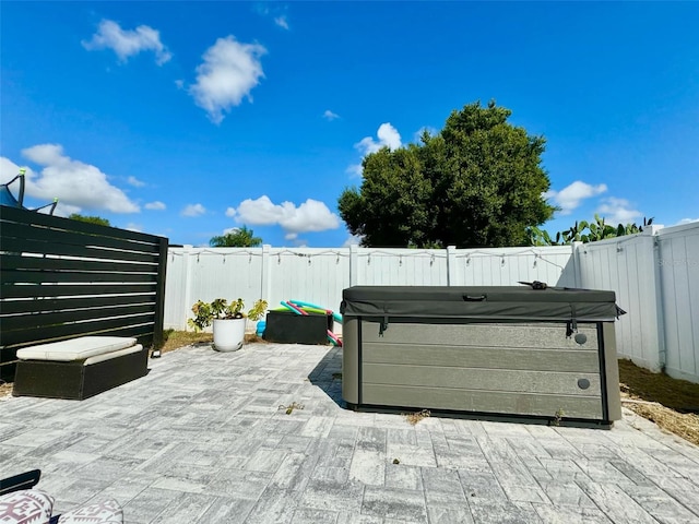 view of patio / terrace featuring a hot tub