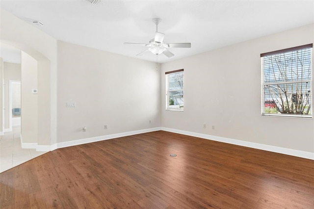 empty room with light hardwood / wood-style flooring and ceiling fan