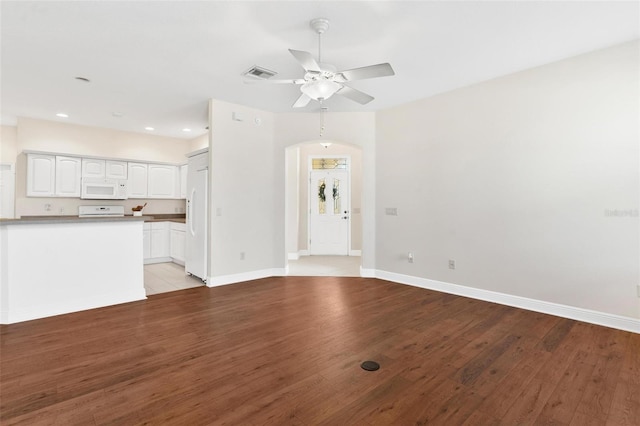 unfurnished living room with ceiling fan and light wood-type flooring