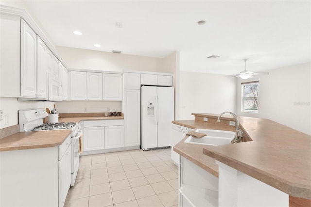 kitchen featuring sink, white appliances, white cabinets, and ceiling fan