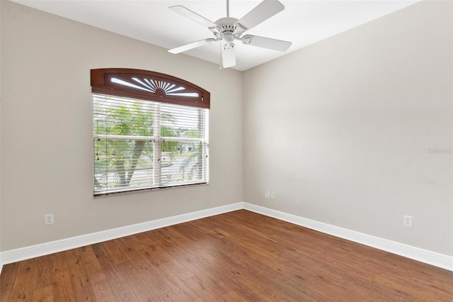 spare room featuring hardwood / wood-style floors and ceiling fan