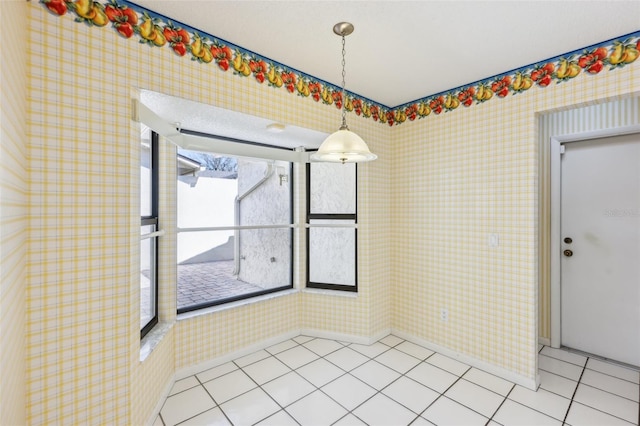 unfurnished room featuring light tile patterned flooring and wallpapered walls