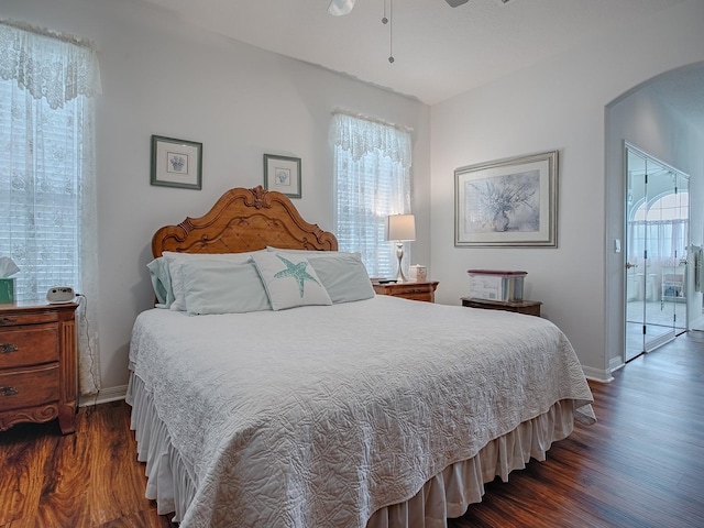 bedroom with dark wood-type flooring and ceiling fan