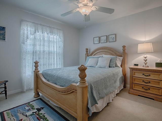 bedroom with light colored carpet and ceiling fan