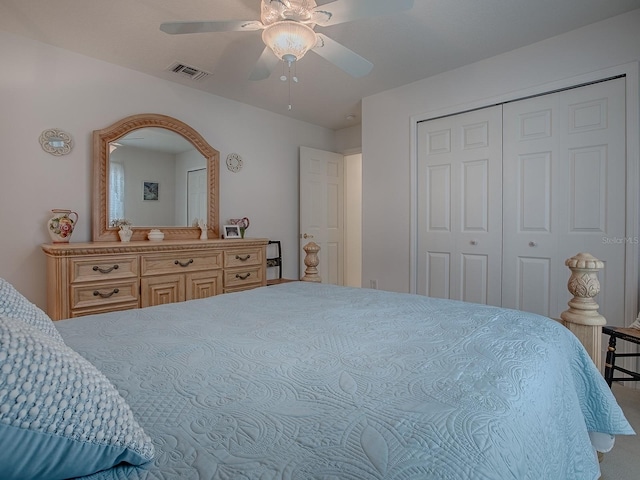 bedroom with ceiling fan and a closet