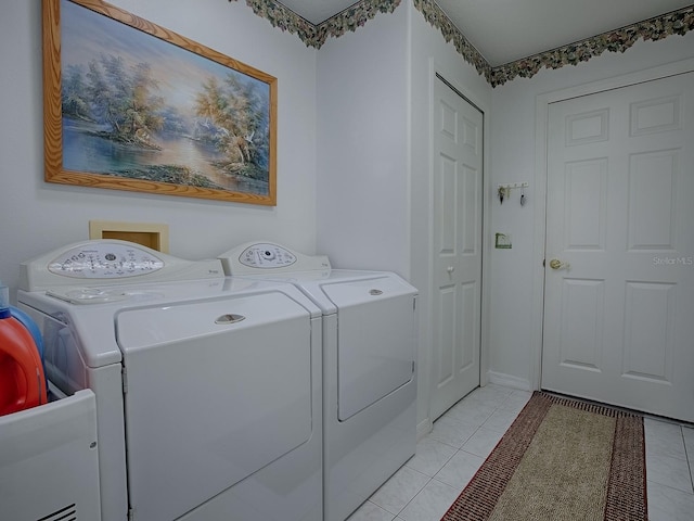 washroom featuring light tile patterned floors and independent washer and dryer