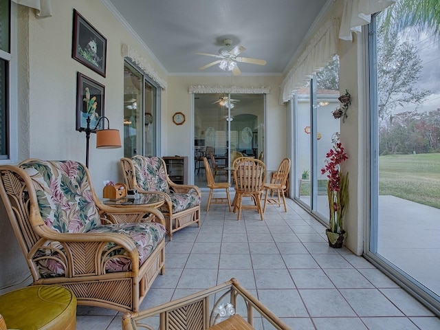 sunroom with ceiling fan