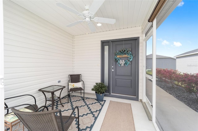 doorway to property with ceiling fan