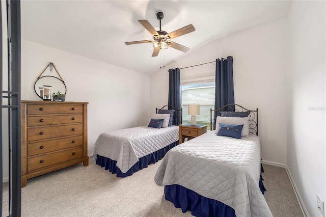 bedroom featuring lofted ceiling, ceiling fan, baseboards, and light colored carpet