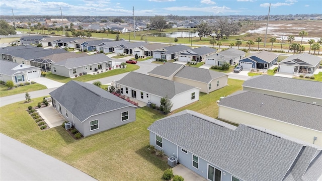 aerial view with a water view and a residential view