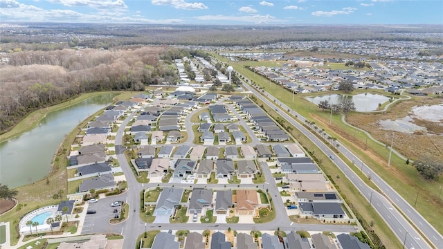 aerial view with a water view and a residential view