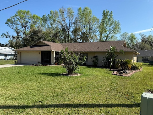 ranch-style house with a garage and a front lawn