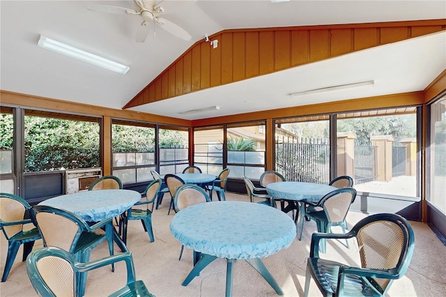 sunroom featuring ceiling fan, plenty of natural light, and vaulted ceiling