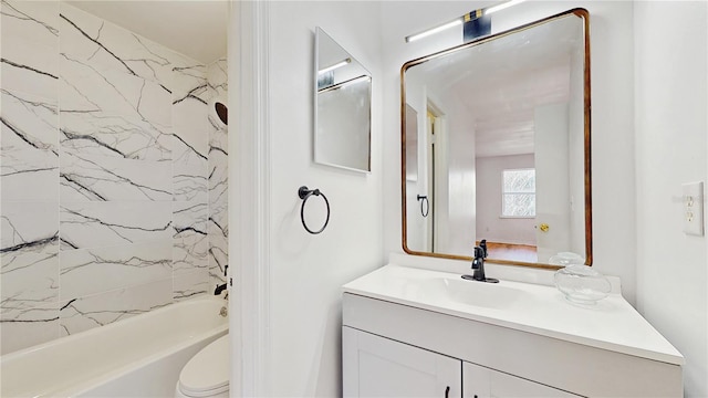 bathroom with toilet, shower / tub combination, and vanity