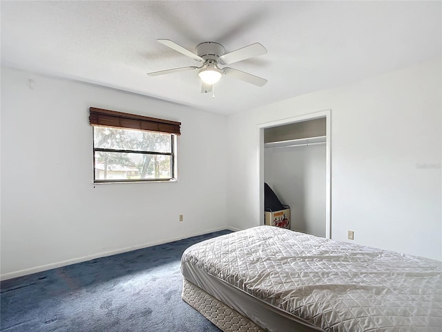 carpeted bedroom featuring ceiling fan and a closet