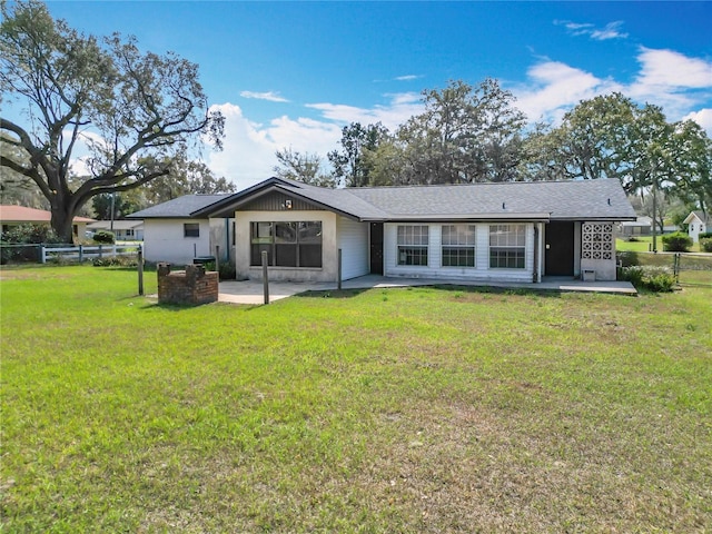 back of house with a patio and a yard
