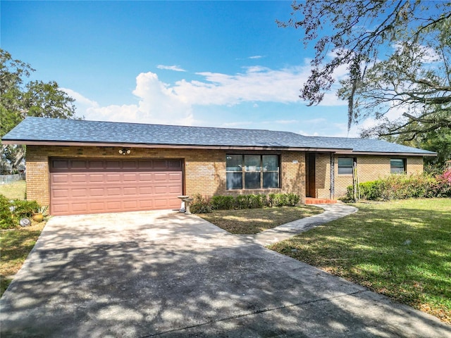 ranch-style house with a garage and a front yard