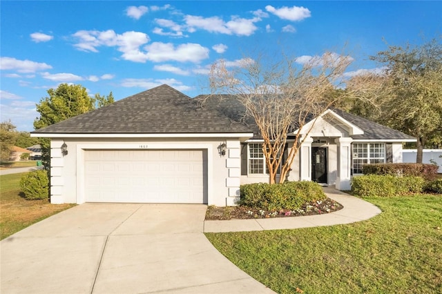 single story home featuring a garage and a front lawn