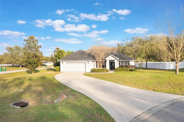 ranch-style house featuring a garage and a front lawn