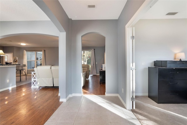 foyer with plenty of natural light and light hardwood / wood-style floors