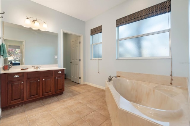 bathroom featuring vanity, a bathtub, and tile patterned floors