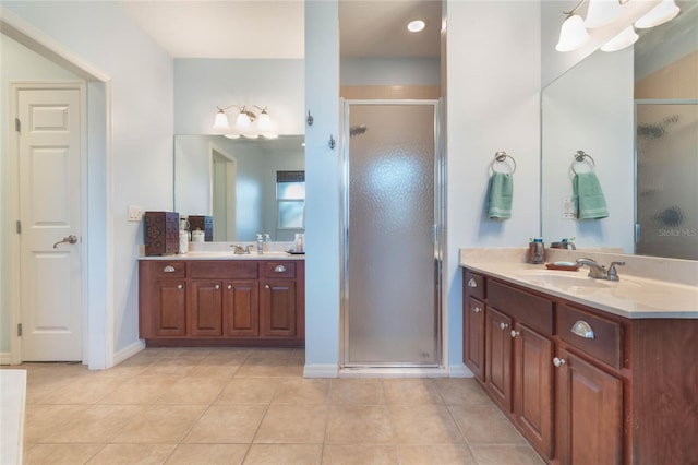 bathroom with tile patterned flooring, vanity, and an enclosed shower