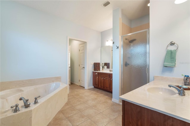 bathroom with vanity, tile patterned floors, and separate shower and tub