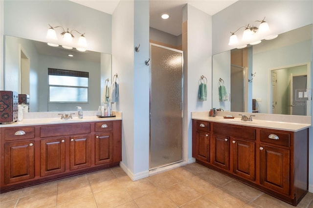 bathroom featuring vanity, tile patterned floors, and a shower with shower door