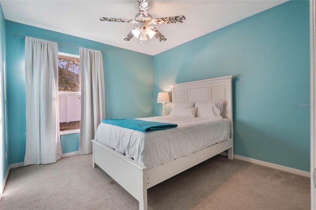 bedroom with ceiling fan and light colored carpet