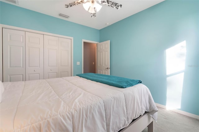 carpeted bedroom featuring a closet