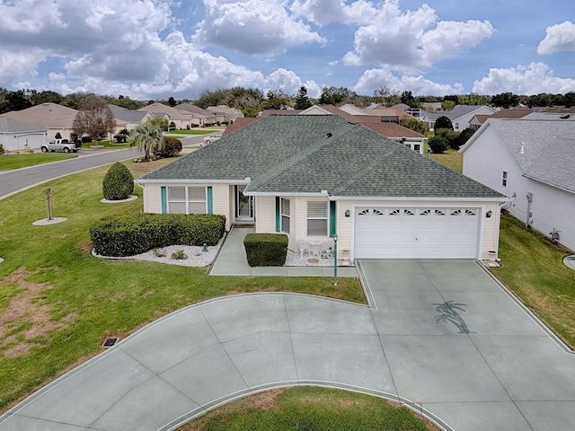 ranch-style house featuring driveway, a shingled roof, an attached garage, and a residential view