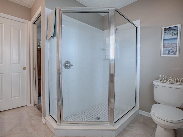full bathroom with a stall shower, baseboards, toilet, marble finish floor, and a textured ceiling