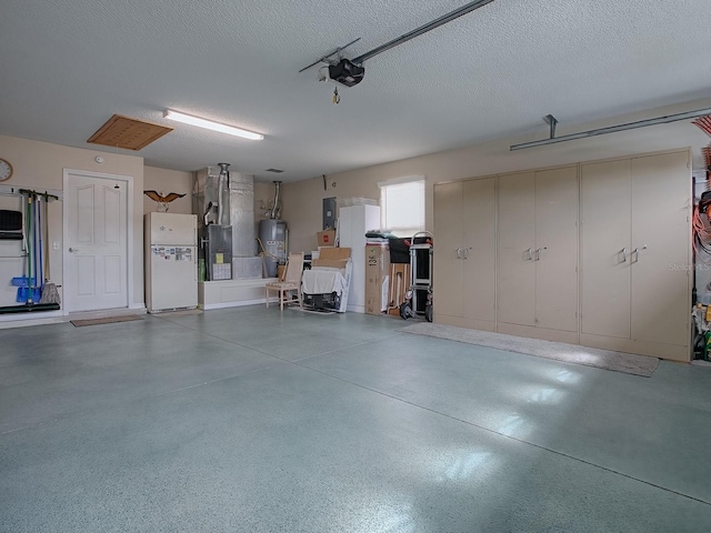 garage with a garage door opener, freestanding refrigerator, electric panel, and water heater