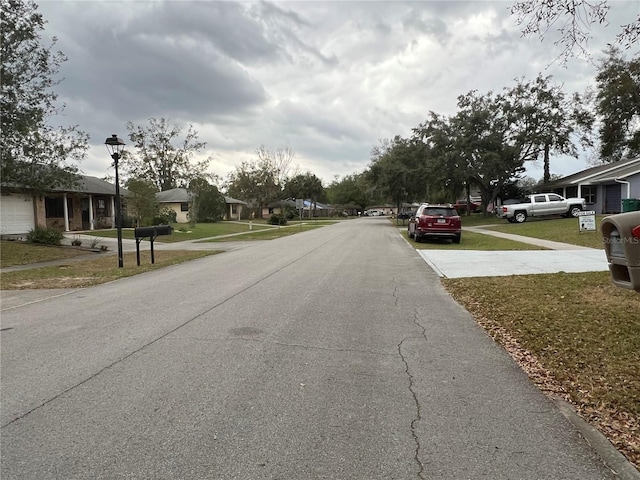 view of street with street lights and a residential view