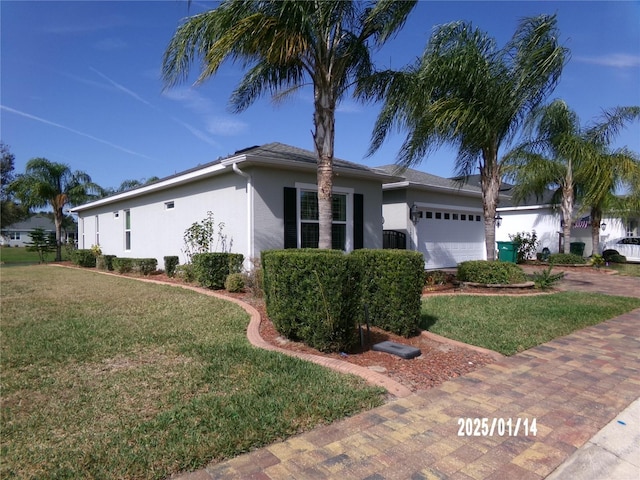 ranch-style house with a front yard and a garage