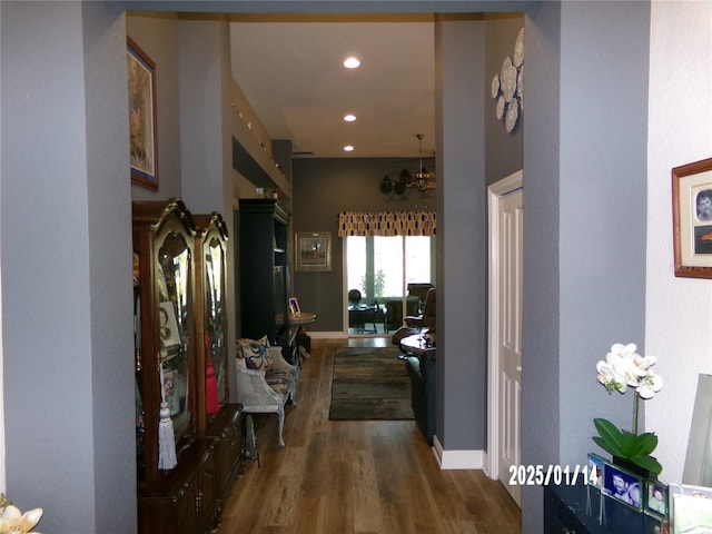 hallway with dark hardwood / wood-style flooring