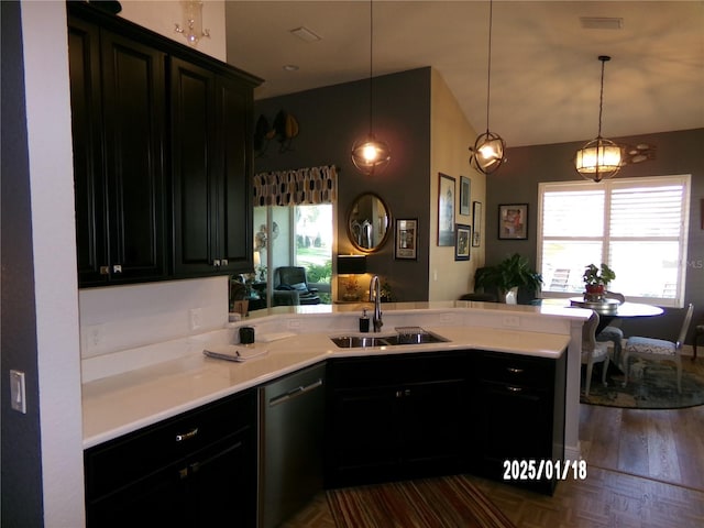 kitchen with sink, kitchen peninsula, pendant lighting, and dishwasher