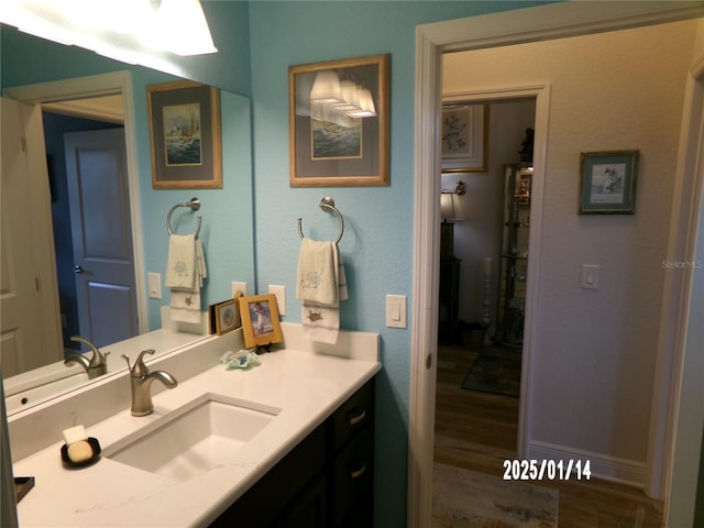 bathroom featuring vanity and wood-type flooring