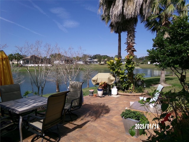 view of patio with a water view